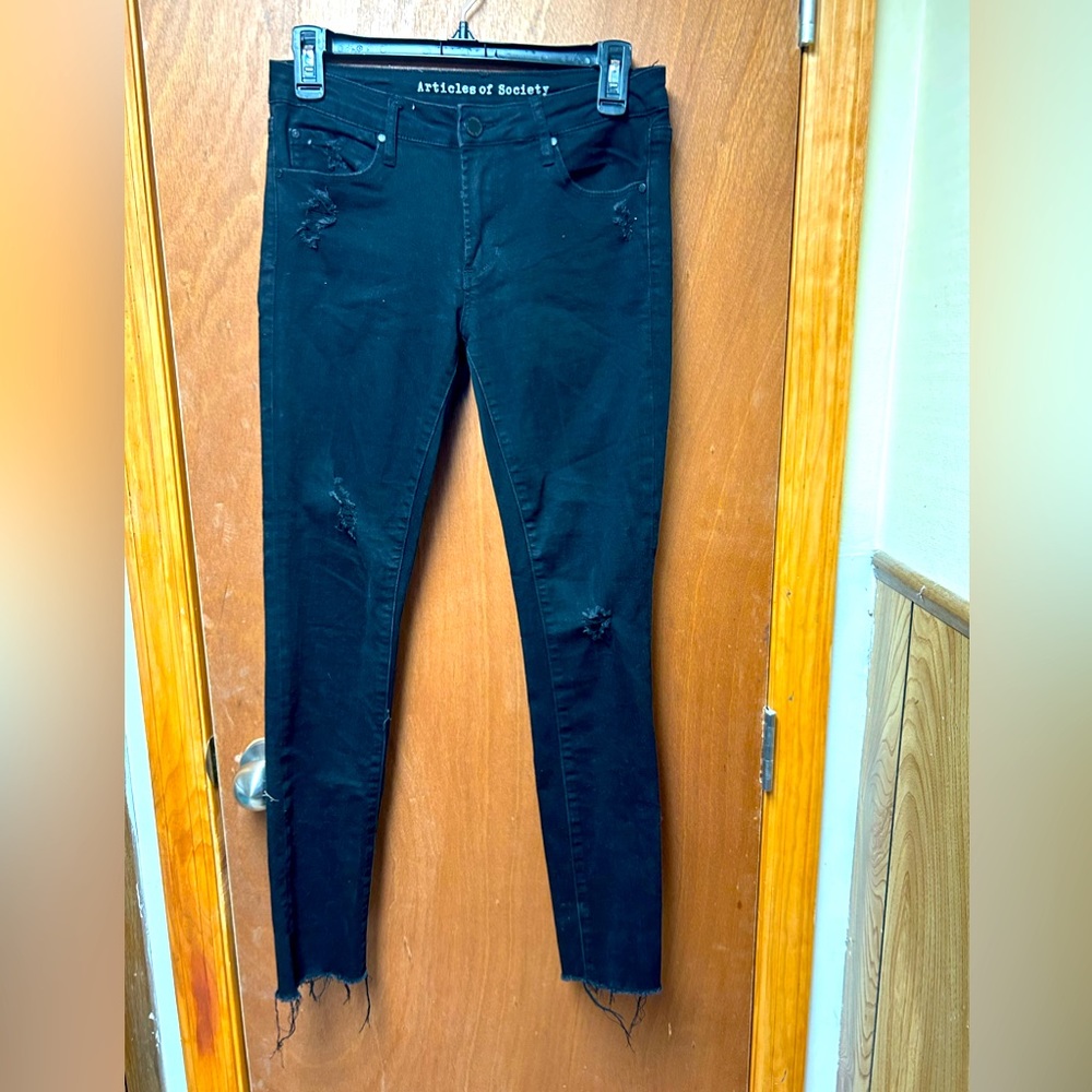 Black distressed look skinny jeans